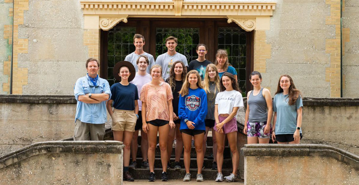 Taylor Davis, a historic preservationist for Jekyll Island Authority, poses for a photo with a group of college students in front of Hollybourne Cottage in the island’s historic district. The students recently completed a two week maymester class in historic preservation on Jekyll.