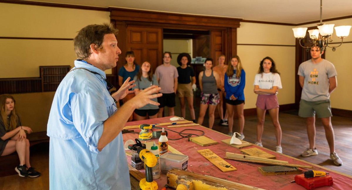 Taylor Davis, a historic preservationist for Jekyll Island Authority, talks with a group of college students in Hollybourne Cottage in the island’s historic district. The students recently completed a two week maymester class in historic preservation on Jekyll.