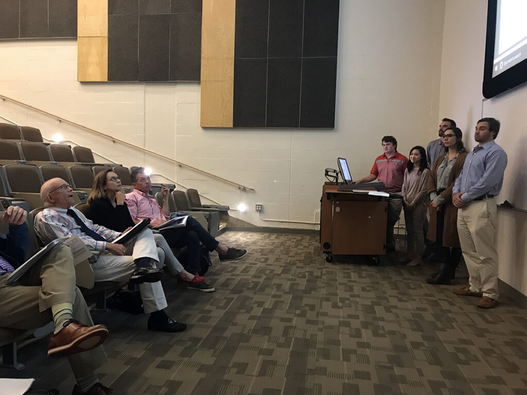 A Shark Tank group presents to judges.