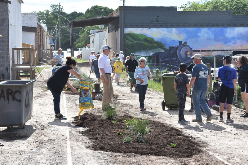 Residents helping to plant Railroad Street Park