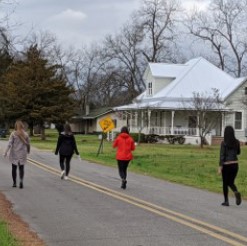 Students walking down Dooly County road
