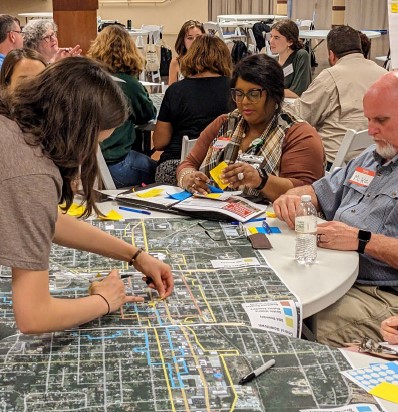 charrette attendees working around a map