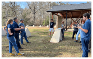 UGA CED students have an outside discussion at Bert Adams Scout Camp.