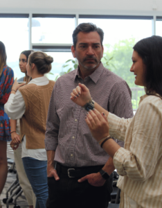 Alfie Vick listens to a UGA CED student talk at an event.