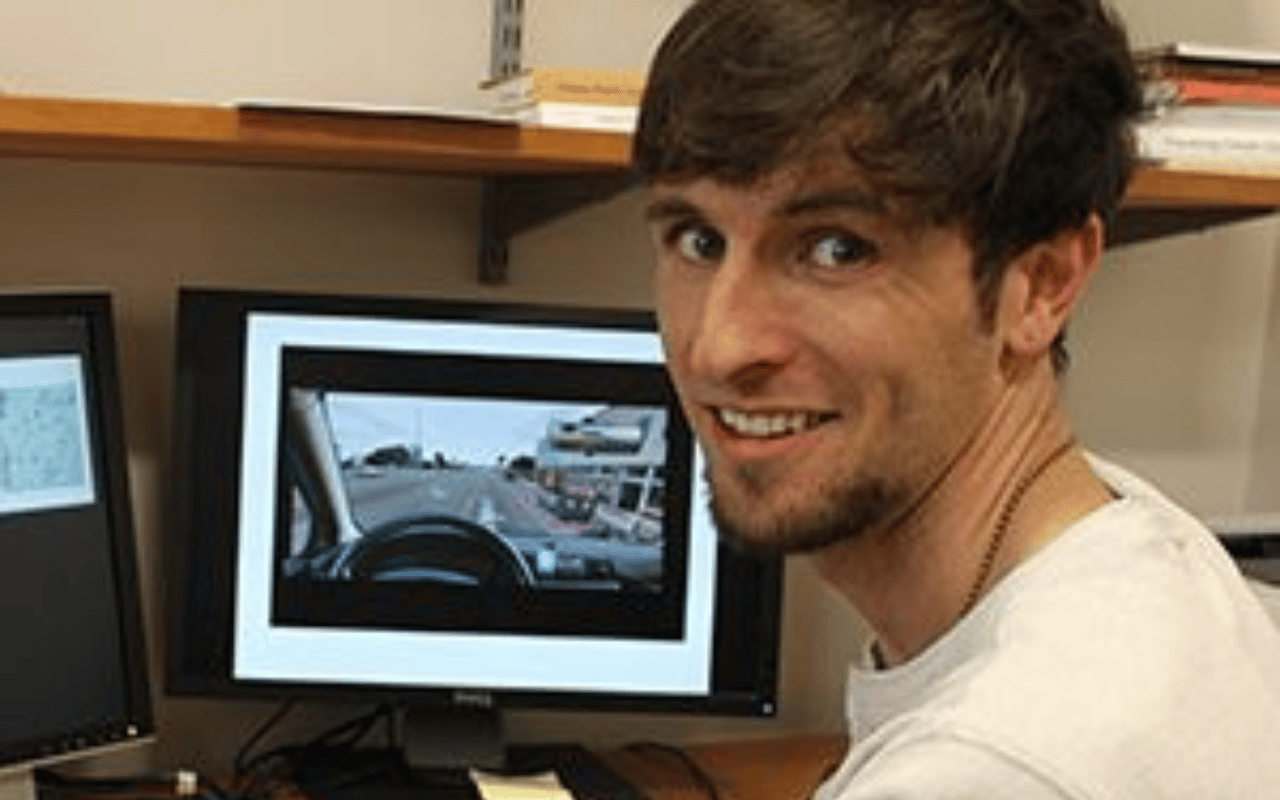 A UGA CED student sits at a computer.