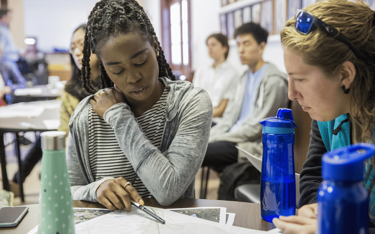 Two women review a design charrette.