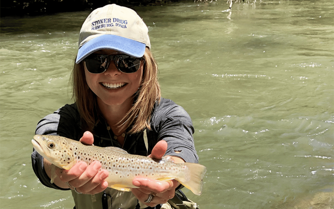 Picture of Emily Rogers holding a fish.