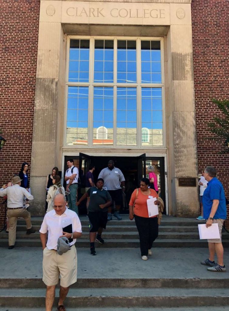 People walk out of Clark College.