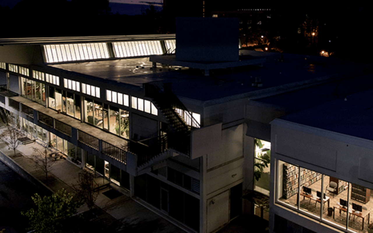 The Jackson Street Building at UGA pictured at night.