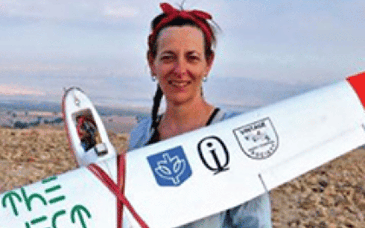 Portrait of Morag Kersel holding a plane.