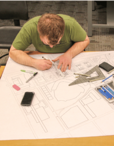 A student works on design plans at the UGA CED.