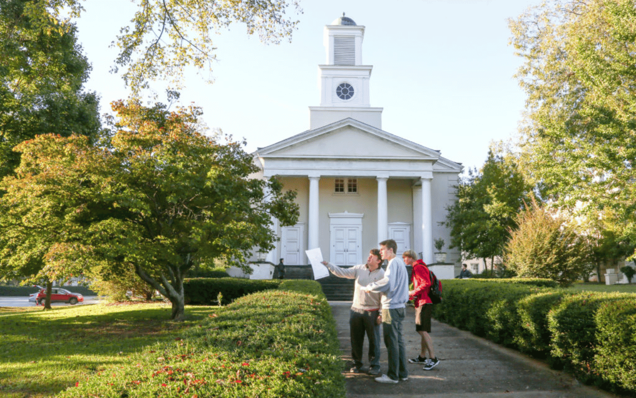 A group from the UGA CED stands in front of a church.