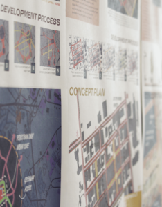 Urban planning concept designs hang on a wall in the UGA Jackson Street Building.