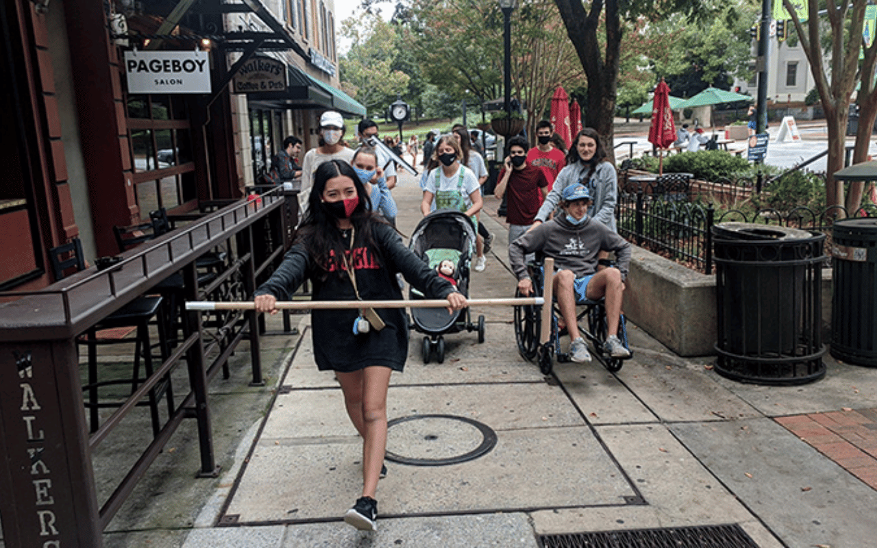 A group walks in downtown Athens during the COVID-19 pandemic.