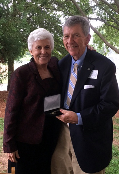 Professor John Waters receives the key to Athens from Mayor Nancy Denson.