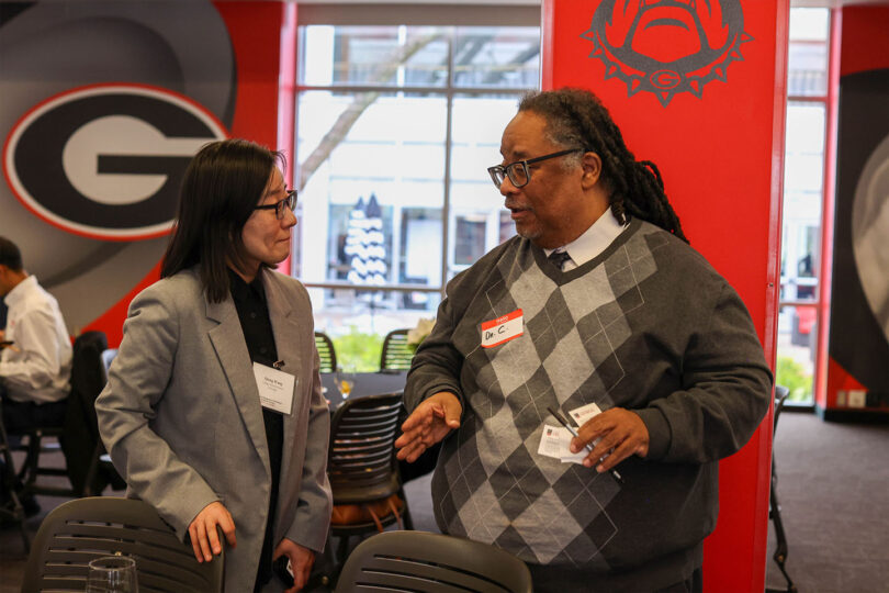 Qiong Wang, assistant professor at the College of Environment and Design and recipient of a 2024 seed grant, talks with 2023 Rural Engagement Workshop participant Llewellyn Cornelius, Donald L. Hollowell Distinguished Professor Social Justice and Civil Rights Studies at the School of Social Work and the director of the Center for Social Justice, Human and Civil Rights. (Photo by Shannah Montgomery, UGA)